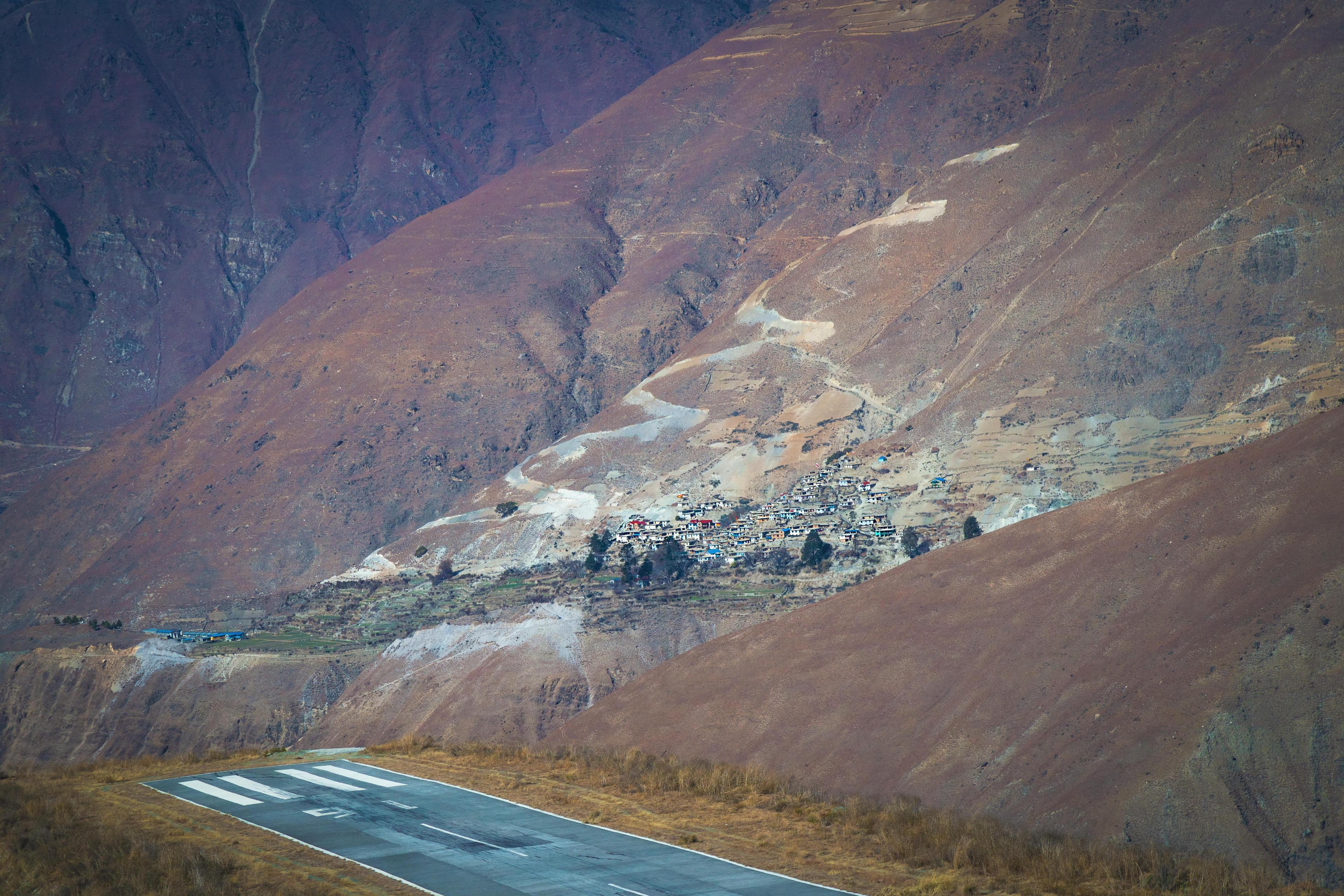 Lukla Airport runway and surrounding mountain landscape