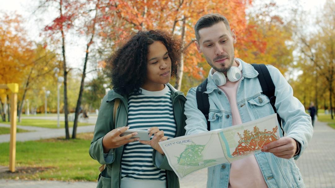 Travelers planning a trip using a map